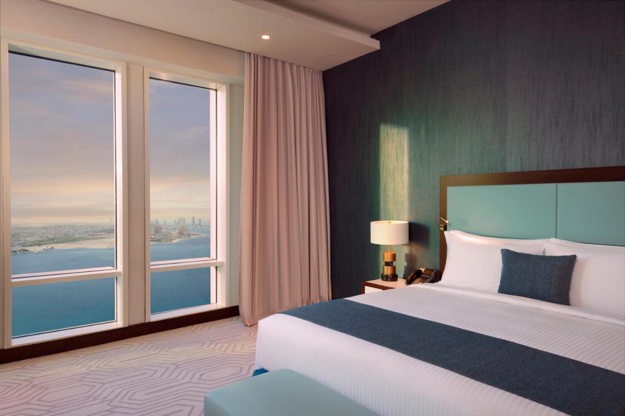 Wyndham Grand Doha West Bay Beach Buitenkant foto A bedroom at the Address Downtown Dubai
